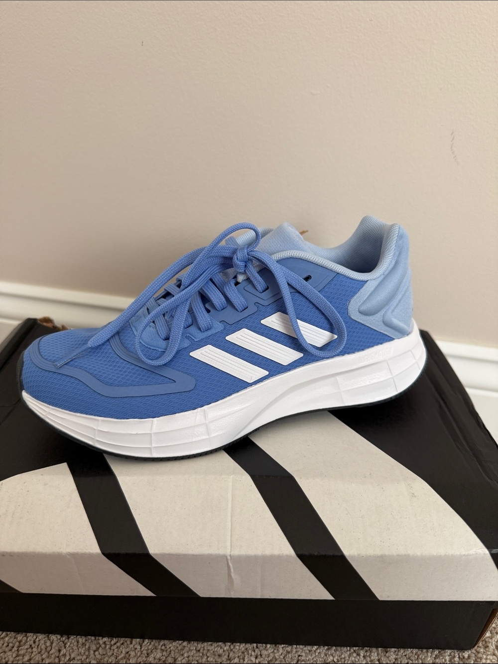 Women’s light blue adidas Duramo 10